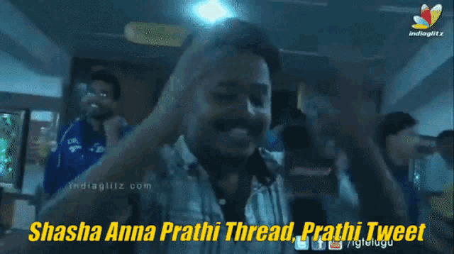 a man in a plaid shirt with the words shashi anna prathi thread prathi tweet below him