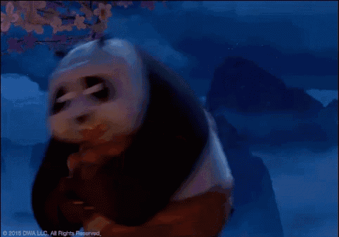 a panda bear from kung fu panda is drinking milk from his mouth
