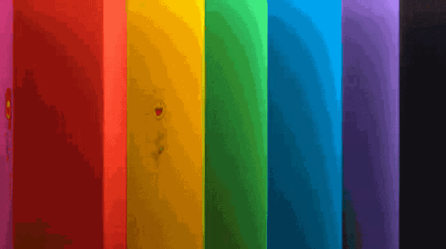 a rainbow of colors is displayed in a row