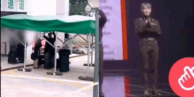 a man in a black suit is standing in front of a green tent