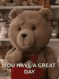 a teddy bear is standing in front of a refrigerator .
