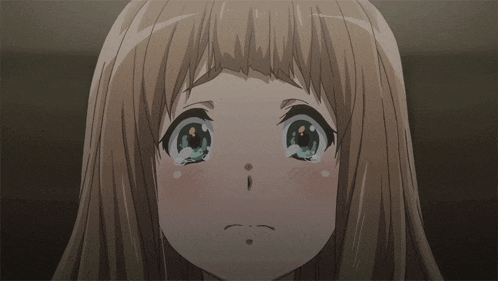 a close up of a girl 's face with tears running down her cheeks