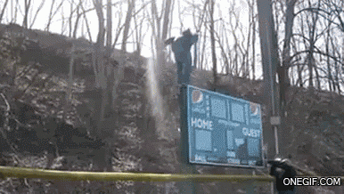 a man is jumping over a scoreboard that says home guest
