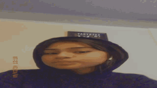a girl taking a selfie with the date 09/02/20 13:18