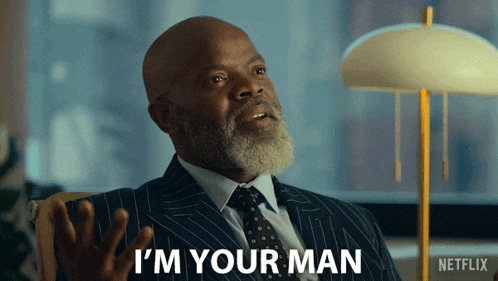 a man in a suit says " i 'm your man "