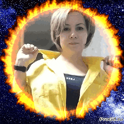 a woman in a yellow jacket is surrounded by a fire circle