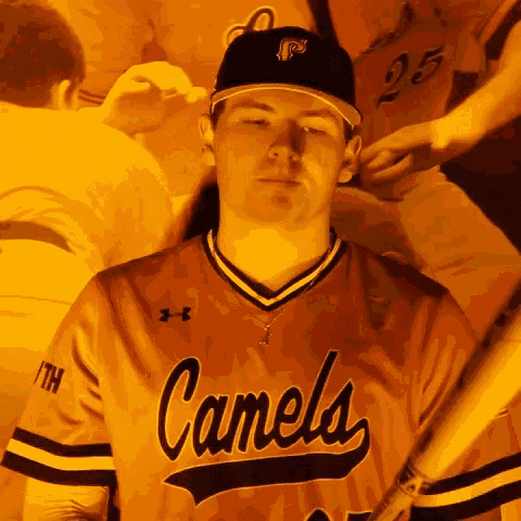a baseball player for the canela team holds a bat