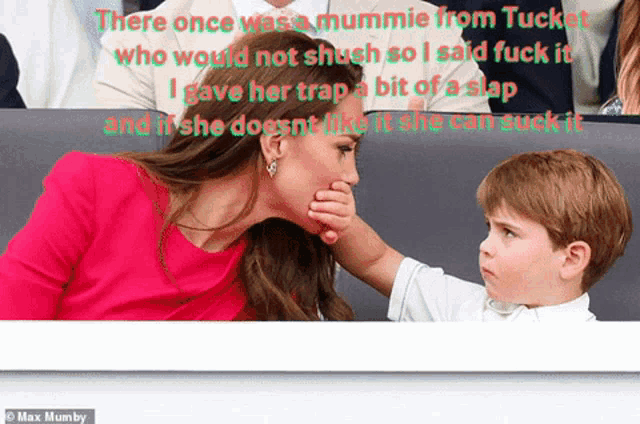 a little boy is touching a woman 's face with his hand