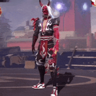 a man in a red and black costume is standing on a basketball court in a video game .
