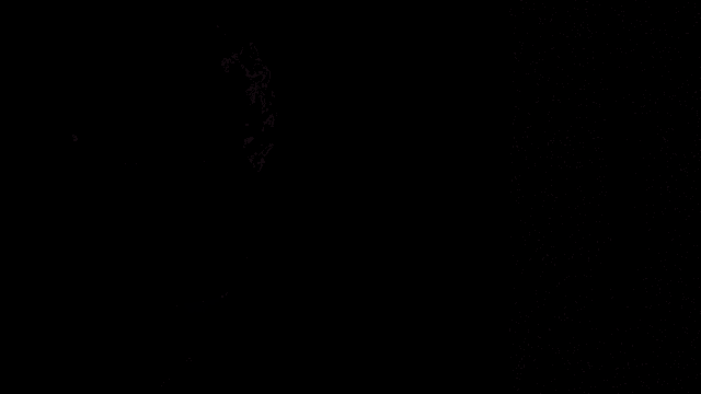 a man with his hands folded in front of a screen with a smiley face on it