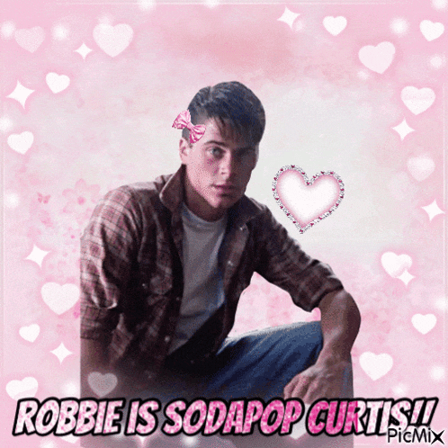 a picture of a man with a bow in his hair and the caption robbie is sodapop curtis