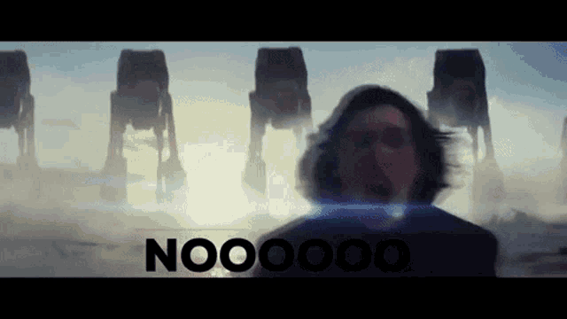 a man screams in front of a row of at at walkers with the word nooo on the bottom