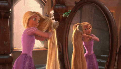 rapunzel from tangled brushes her hair in front of a mirror