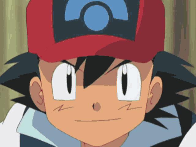a close up of a person wearing a red hat