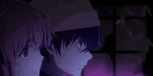a boy and a girl are looking at each other