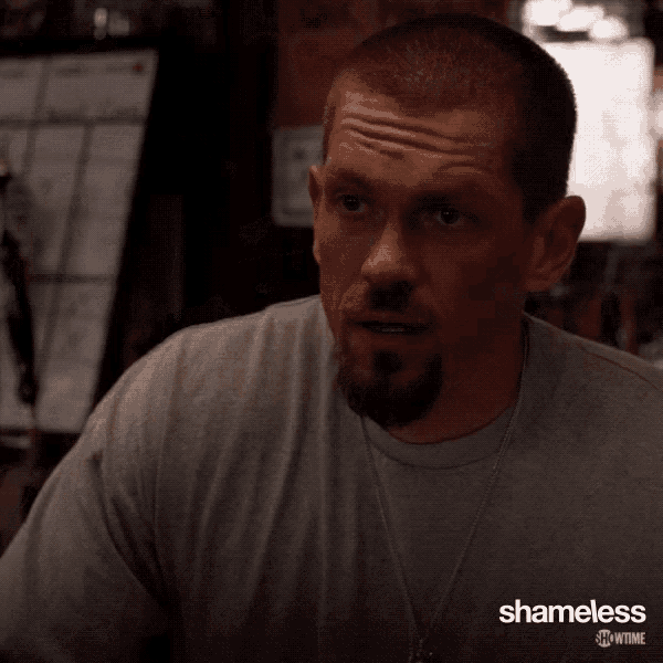 a man with a beard is wearing a showtime shameless shirt
