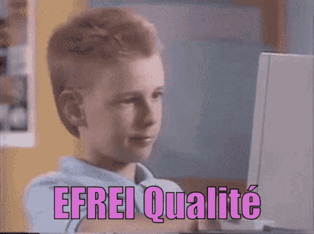a young boy sitting in front of a computer with the words " efrei qualite " written on the screen