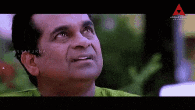 a close up of a man 's face with the words annapurna studios in the corner