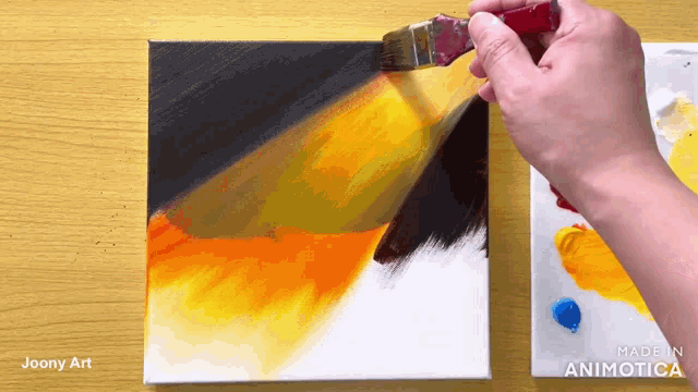 a person is painting on a canvas with a brush and the words made in animatica on the bottom