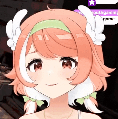 a close up of a girl 's face with a headband with wings on it