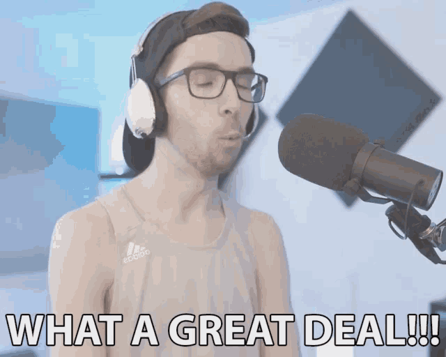 a man wearing headphones and a tank top that says adidas