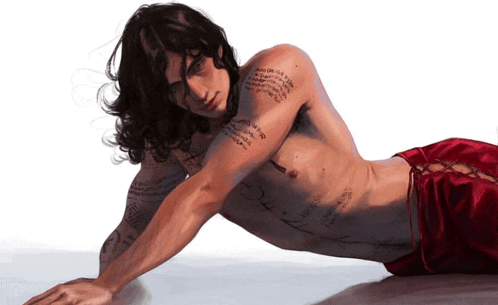 a shirtless man with a tattoo on his arm that says ' i love you '