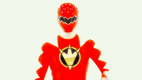 a red power ranger is jumping in the air with his arms in the air