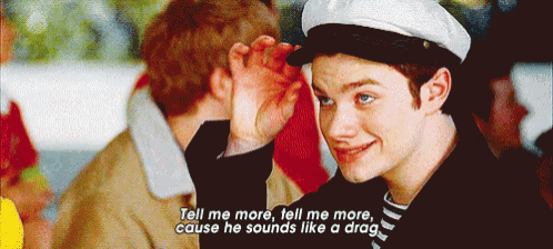a man in a sailor hat says tell me more