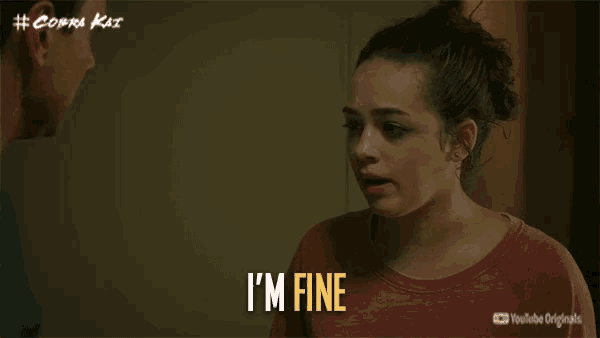 a woman says " i 'm fine " in front of a man