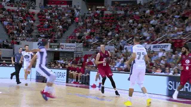 a basketball game is being played in a stadium with a mercury ad on the wall