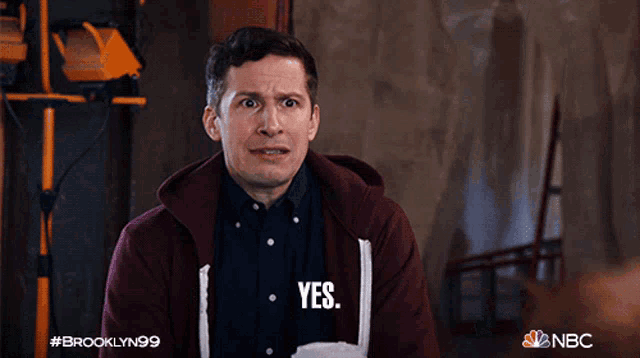 a man in a maroon hoodie says " yes "