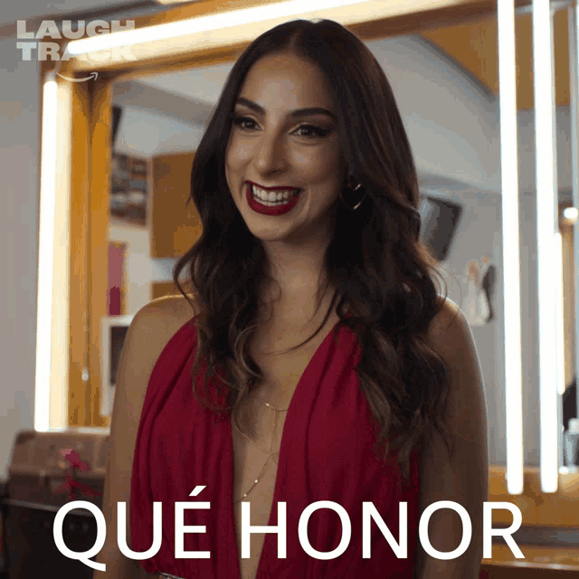 a woman in a red dress stands in front of a mirror with the words que honor written on the bottom