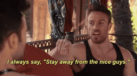 two men are sitting on a couch and one of them is saying " stay away from the nice guys "