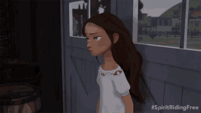 a girl in a white shirt is standing in front of a door with the hashtag spirit riding free