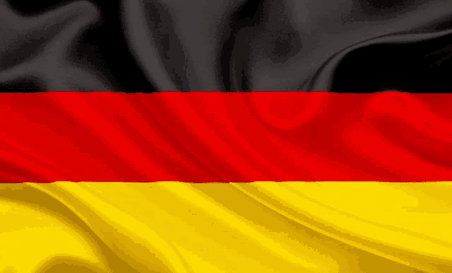 a close up of a german flag with black red and yellow
