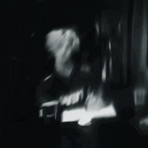 a black and white photo of a man wearing a shirt that says 1win