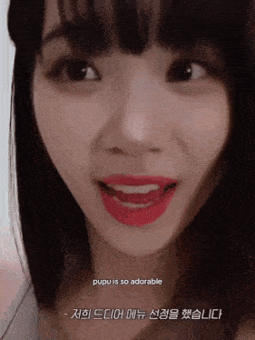 a close up of a woman 's face with a caption that says pupu is so adorable ..