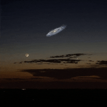 a galaxy is visible in the night sky with a crescent moon in the foreground
