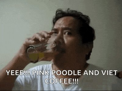 a man is drinking a glass of beer with the words `` yeee ! pink poodle and viet coffee ! ''