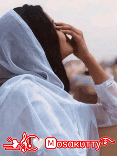 a woman with a white scarf on her head and the word mosaktty on the bottom right