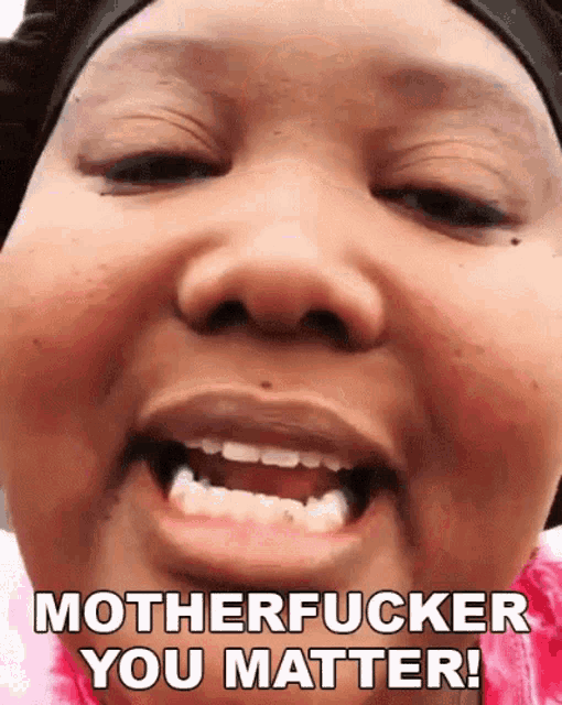 a close up of a woman 's face with the words motherfucker you matter written on it