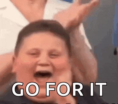 a young boy is screaming with his mouth open and the words `` go for it '' written on the bottom .