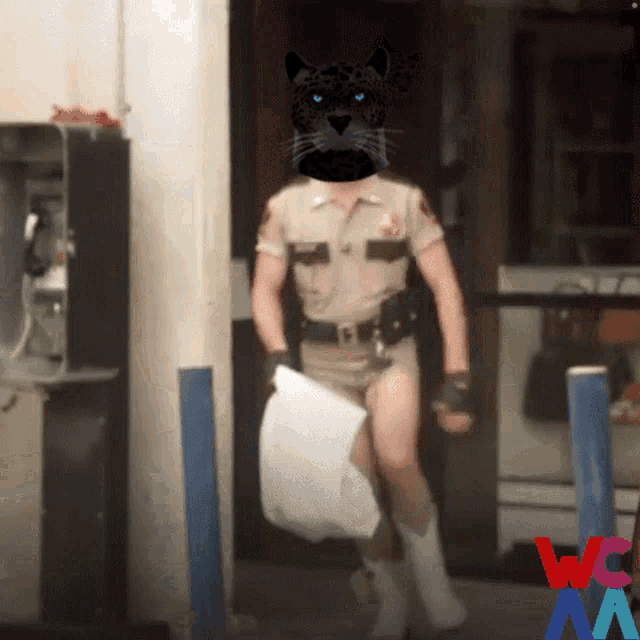 a man in a sheriff 's uniform with a black panther head