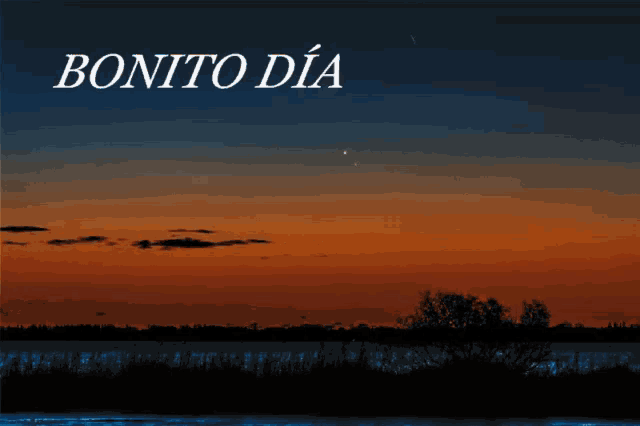 a sunset with the words bonito dia written above it