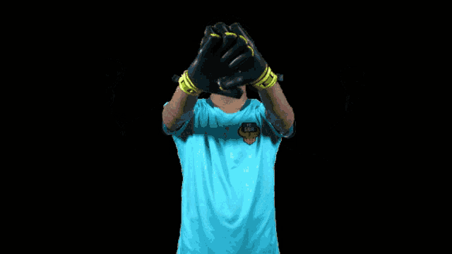 a soccer player wearing a blue shirt that says ' fc delhi ' on it
