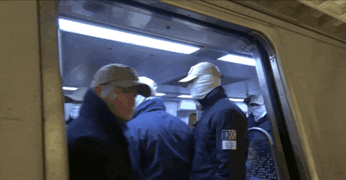 a man wearing a hat and a jacket with a patch that says ' u.s. olympic team '
