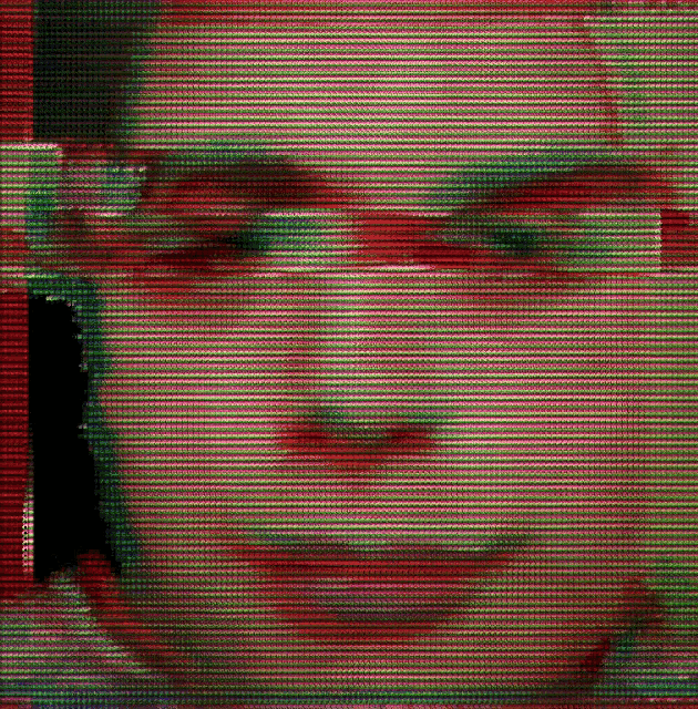 a close up of a person 's face with a red and green pattern
