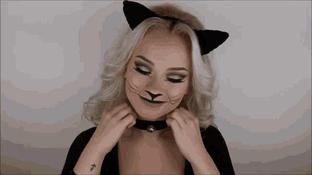 a woman with a tattoo on her wrist that says ' t '