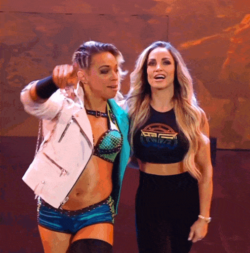 two women are standing next to each other and one is wearing a shirt that says ' intercontinental '