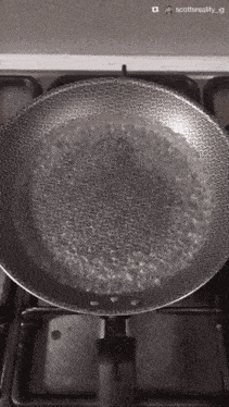 a pan of boiling water on a stove with scottsreality ig